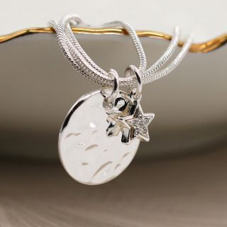 Silver plated disc and star charm bracelet